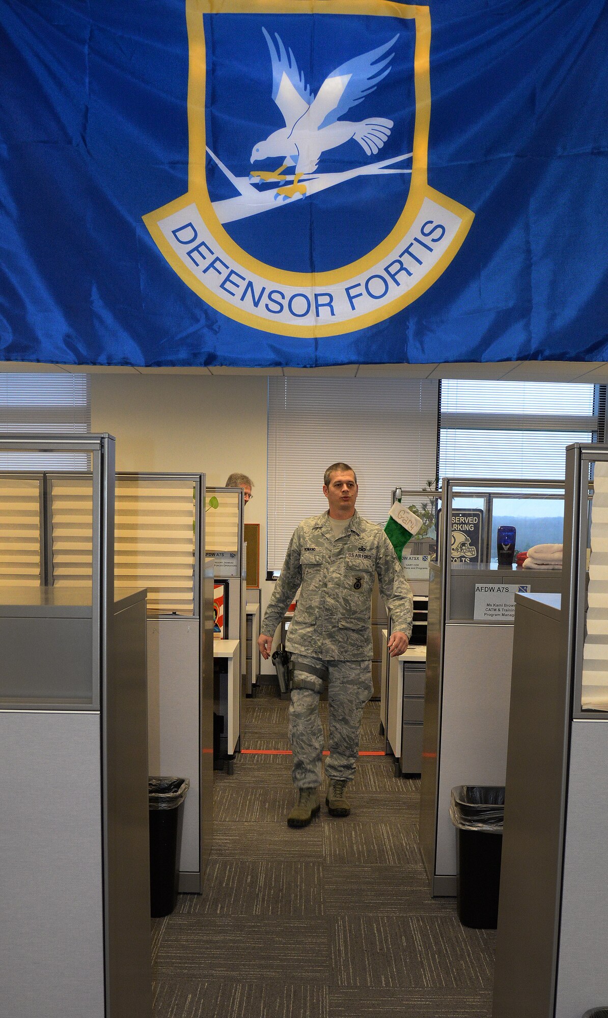 Master Sgt. Chris Romano, Air Force District of Washington Security Forces Plans and Programs Branch superintendent, is armed with an M9 service pistol at the William A. Jones III building on Joint Base Andrews, Md., Dec. 30, 2015. Staff arming allows AFDW personnel with a Security Forces background to be armed in the building while working in a staff position to prevent active shooter threats. (U.S. Air Force photo/1st Lt. Esther Willett)