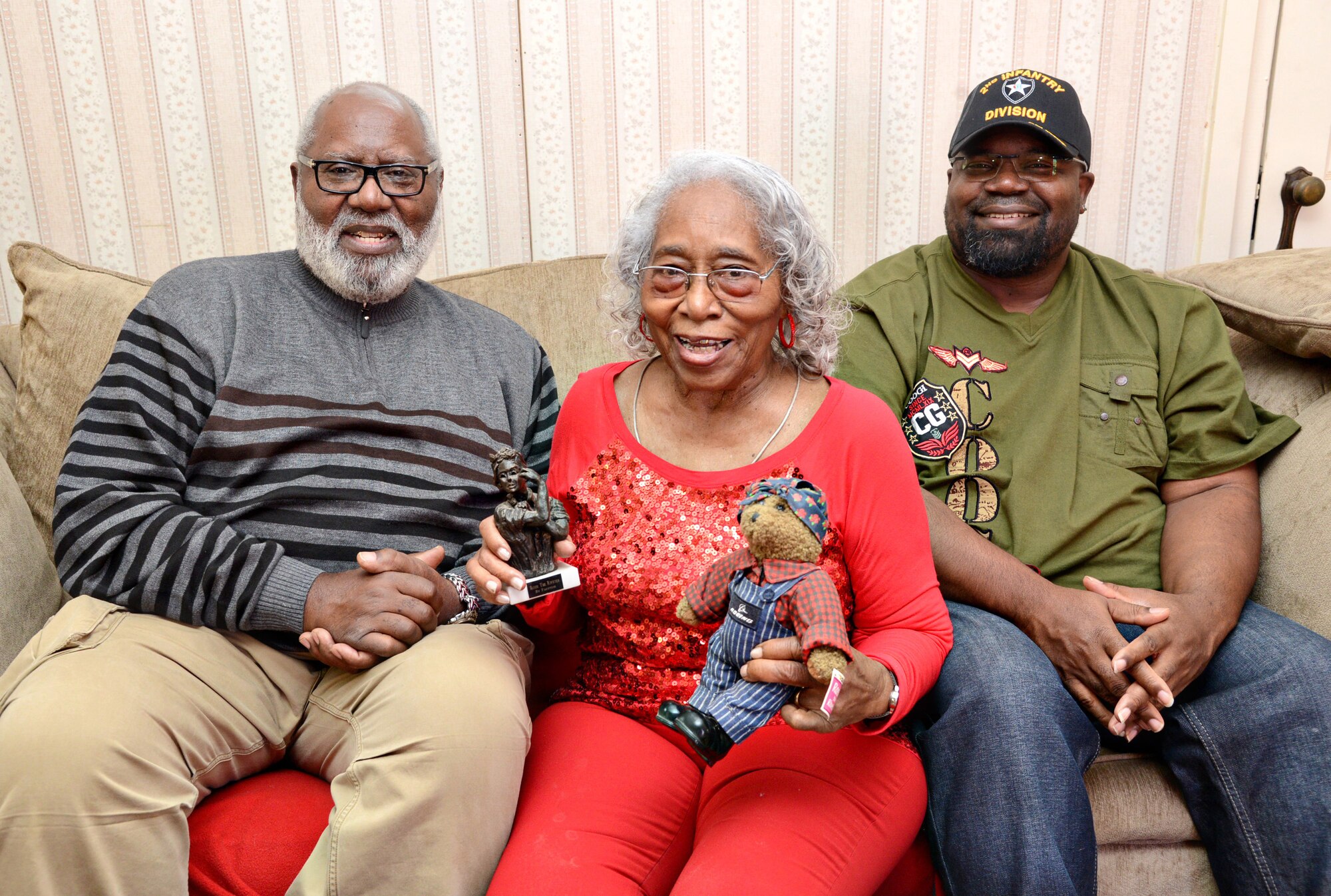 An original Rosie the Riveter, Eulila Davis, center, started her family’s civil service tradition in 1943 when Tinker Air Force Base was known as Douglas Field. With Ms. Davis are her son, Lloyd, left, and grandson, Steven, who both also worked at Tinker. (Air Force photo by Kelly White/Released)
