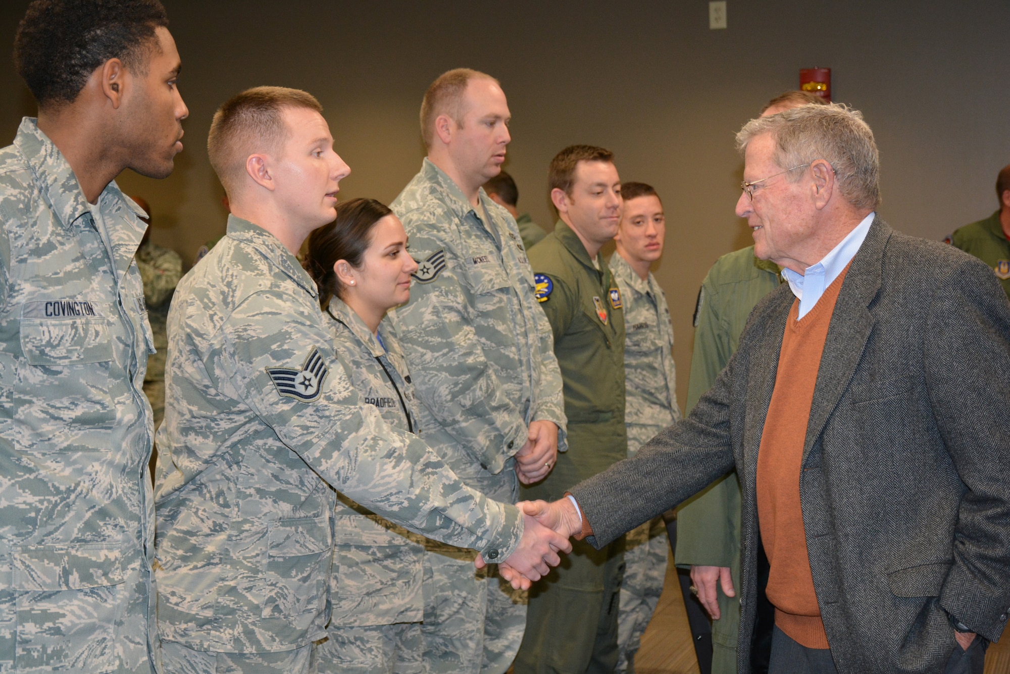 U.S. Sen. Jim Inhofe, R-Okla., greets Staff Sgt. Joshua O’Dell during a visit with Airmen from the 552nd Air Control Wing Jan. 15. Sergeant O’Dell, from Oklahoma City, is a Computers/Electronic Warfare Craftsman with the 552nd Maintenance Squadron.  He leads a four-member C/EW team that accomplishes scheduled and unscheduled maintenance on 27 E-3s valued at $8.9 billion. During his visit to Tinker, Senator Inhofe received an update on the KC-46A beddown, toured the new 966th Airborne Air Control Squadron location in Bldg. 201 and met with several Airmen, including Sergeant O’Dell, who had just returned from a recent deployment. (Air Force photo by Darren D. Heusel/Released)