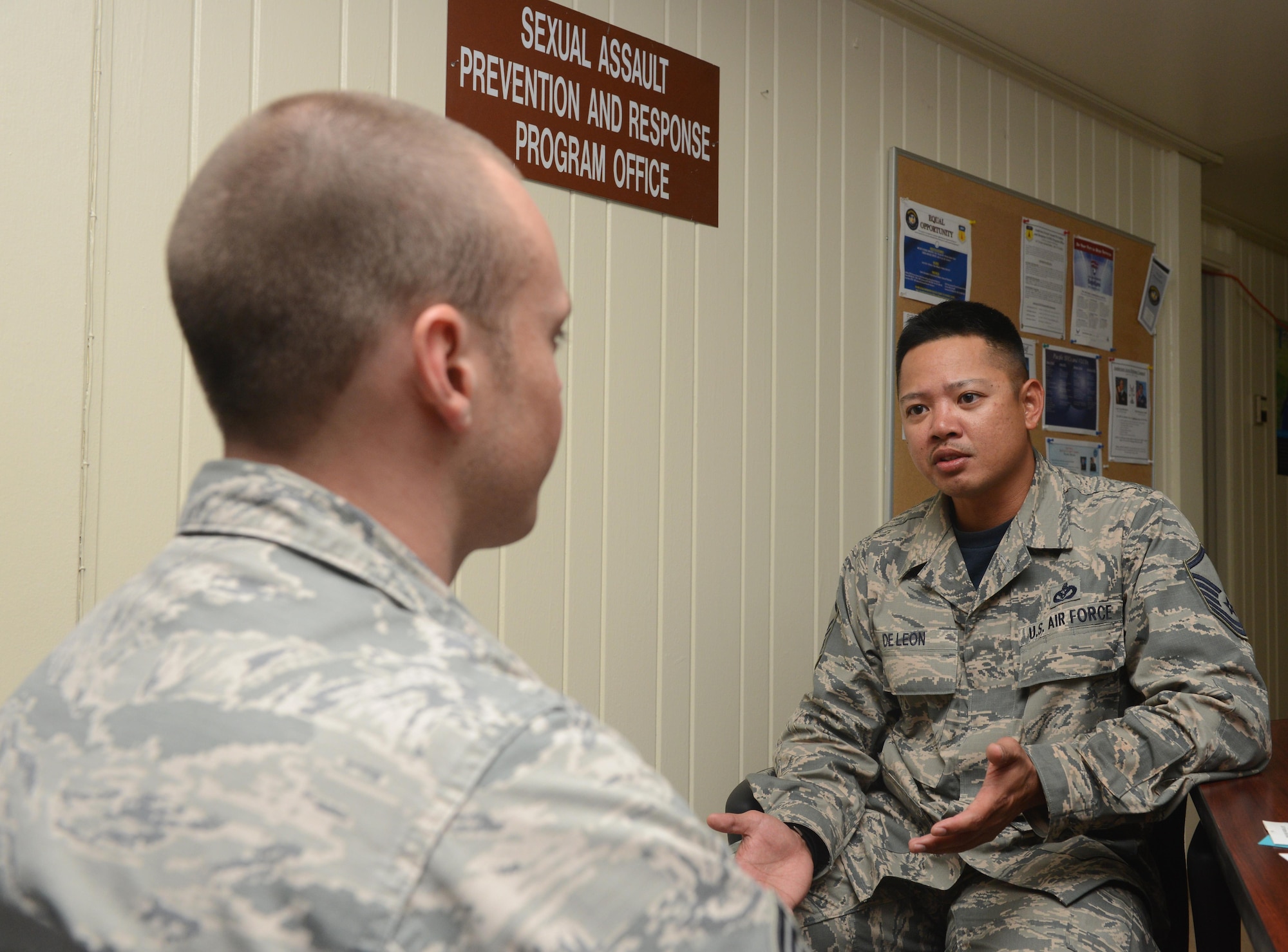 Master Sgt. Dan De Leon, 36th Civil Engineer Squadron NCO in charge of planning, who is also a part-time victim advocate, speaks to an Air Force member about Sexual Assault Prevention and Response program Jan. 20, 2016, on Andersen Air Force Base, Guam. Victim advocates are trained to respond as support for sexual assault victims, helping them through the investigation and providing resources to assist them in making informed decisions about their case. (U.S. Air Force photo/Airman 1st Class Arielle Vasquez)