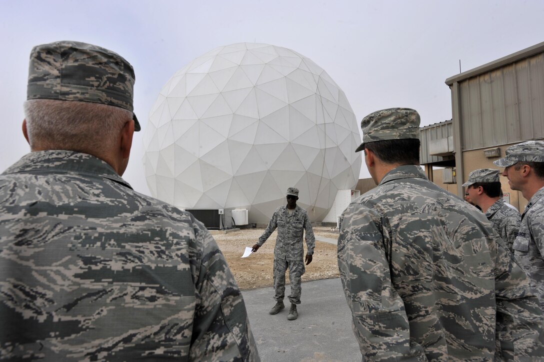 Lt. Col. Carlos Alford, 379th Expeditionary Communications Squadron commander, briefs attendees about the new Modernized Enterprise Terminal at Al Udeid Air Base, Qatar, Jan. 21, 2016. The 379 ECS recently completed an upgrade to their Army, Navy Ground Satellite Communications system which will enable better communications for warfighters. (U.S. Air Force photo by Master Sgt. Joshua Strang)