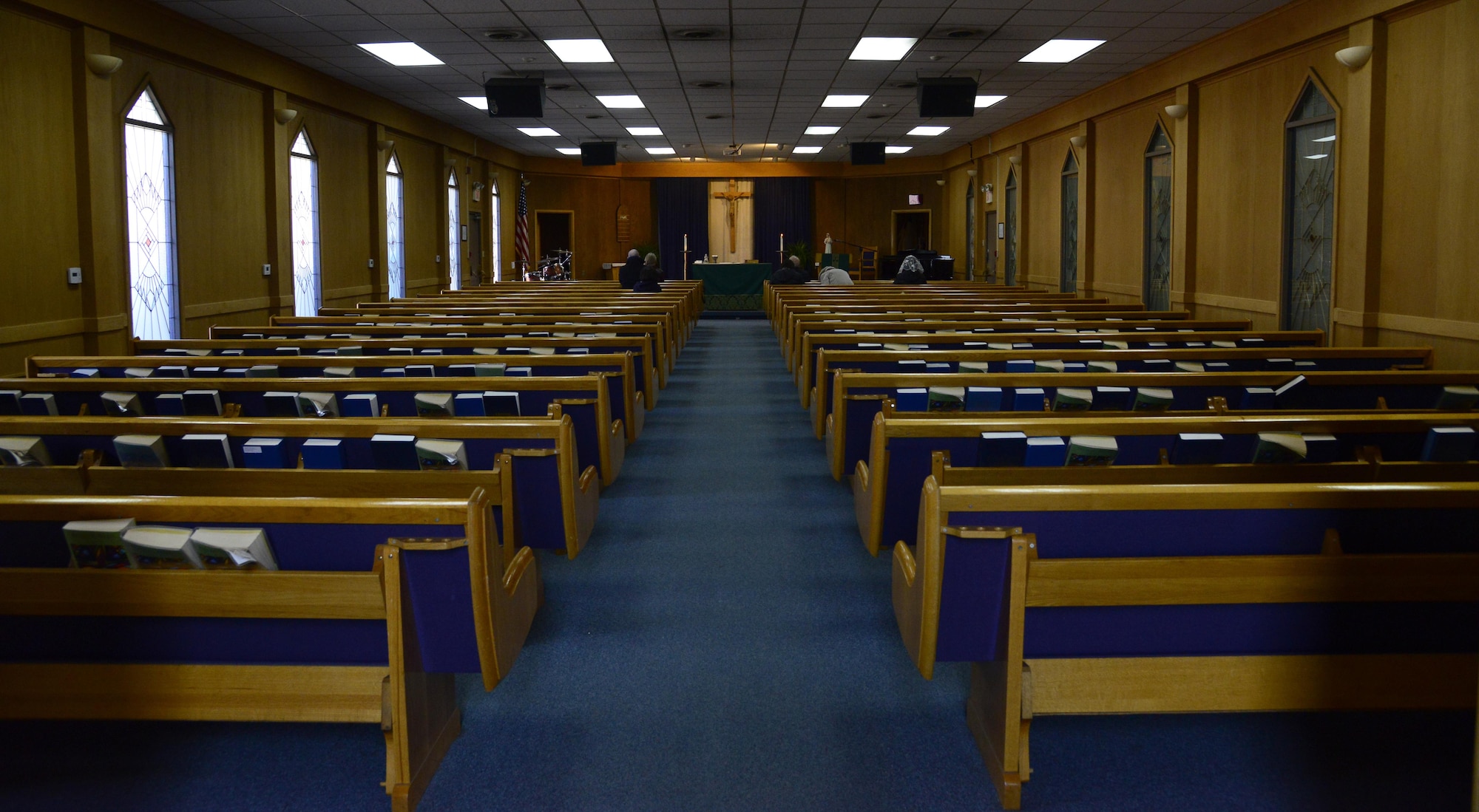 Members of Team Osan pray in the chapel on Osan Air Base, Republic of Korea, Jan. 13, 2016. The Osan Chapel Team offers a variety of services to help Airmen practice spiritual health and well-being. They also offer services to assist with stressors that may come up through work or home life. (U.S. Air Force photo by Senior Airman Kristin High/Released)