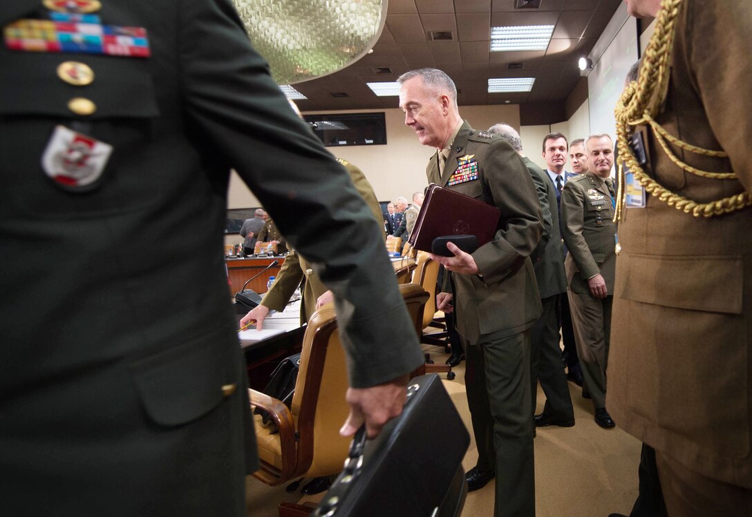 U.S. Marine Corps Gen. Joseph F. Dunford Jr., center, chairman of the Joint Chiefs of Staff, prepares for a meeting with his counterparts at NATO headquarters in Brussels, Jan. 21, 2016. DoD photo by D. Myles Cullen