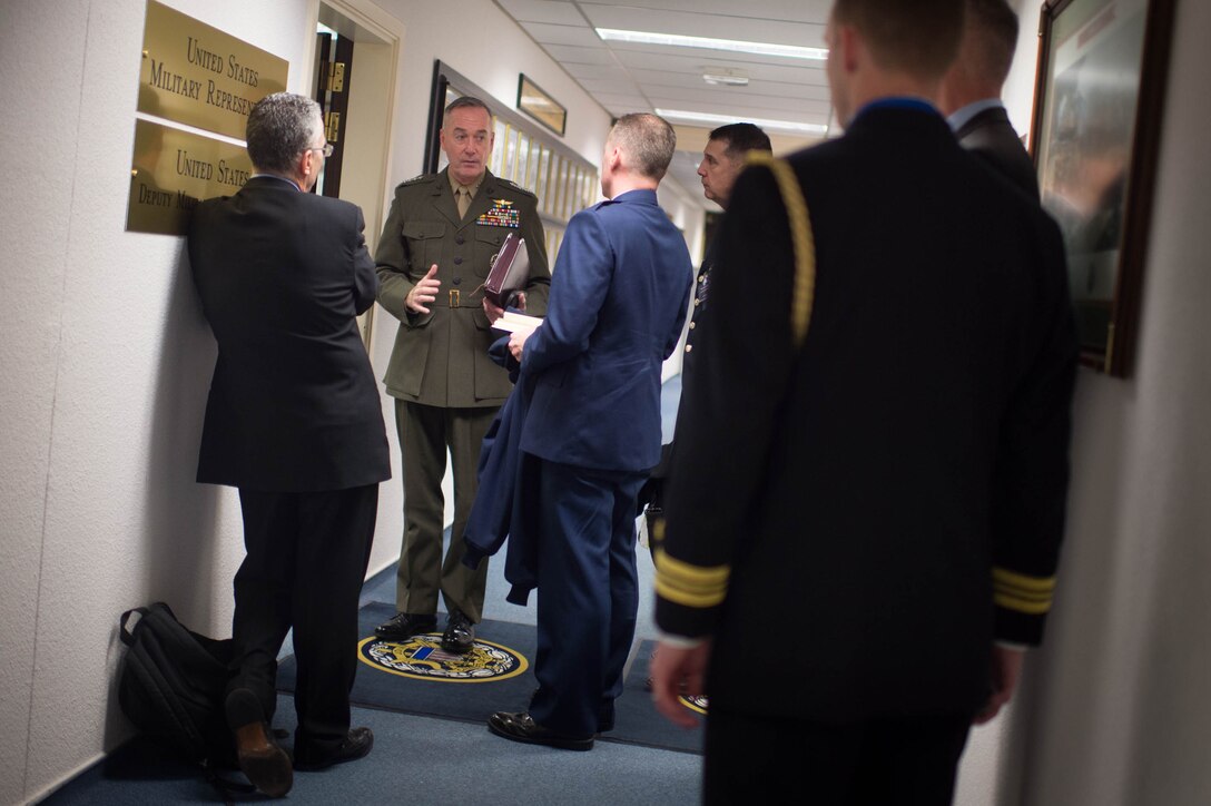 U.S. Marine Corps Gen. Joseph F. Dunford Jr., center left, chairman of the Joint Chiefs of Staff, talks with members of his staff after meetings with the military leaders at NATO headquarters in Brussels, Jan. 21, 2016. DoD photo by D. Myles Cullen