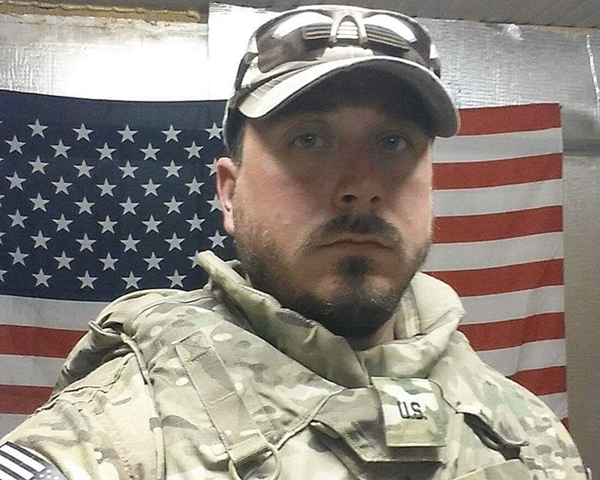Christopher Koons, 47th Flying Training Wing chief of personnel security, poses for a photo while at Bagram Airfield, Afghanistan, Sept. of 2015. During his six-month deployment, Koons wore the same uniform and worked side by side with his military counterparts. (Courtesy photo)  