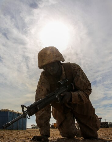 Private James N. Gathondu, Charlie Company, 1st Recruit Training Battalion, high crawls with his rifle during an event of the Crucible at Marine Corps Base Camp Pendleton, Calif., Jan. 13. Gathondu graduated recruit training as the Company Ironman, the most physically fit Marine in his company. Following recruit training, he will move on to Marine Combat Training in Camp Pendleton, Calif., and then on to his military occupational specialty school for his job as a motor transportation operator. He plans on making a career out of Marine Corps. Gathondu is a native of Kikuyu, Kenya, and was recruited out of Recruiting Station Fort Worth, Texas.