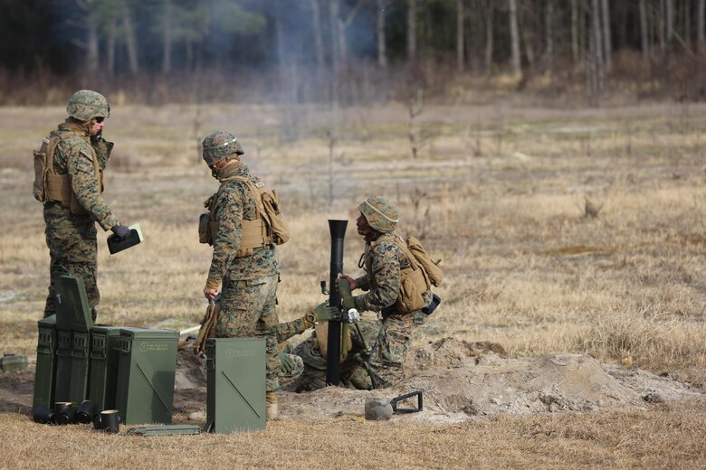 Marines with 2nd Battalion, 2nd Marine Regiment,  launch  a round during a live-fire mortar exercise with 81 mm mortar systems in preparation for the unit’s upcoming deployment at Camp Lejeune, N.C., Jan. 21. The Marines worked with the mortar systems until the late evening, sending more than 350 rounds downrange, and accomplished their goal of having more than 90 percent of their rounds impact on their designated targets. (U.S. Marine Corps photo by Cpl. Shannon Kroening/ Released)