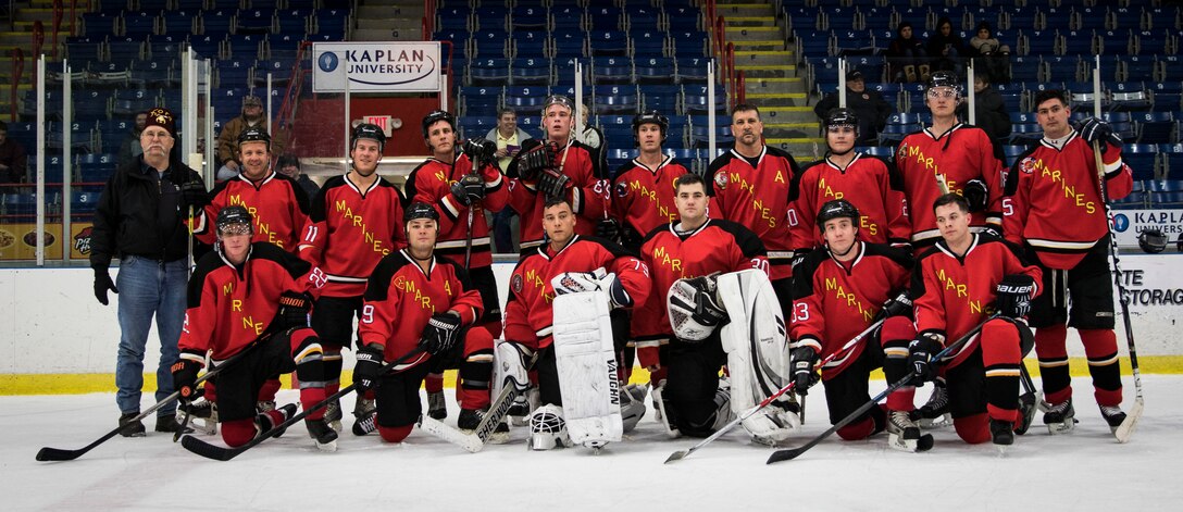 The Marine Corps Ice Hockey Team poses for a photo following first game during The Maine Event, Battle on Ice hockey tournament, Jan. 15. The team is made up of 40 players from across the Marine Corps, 15 of whom are playing in the tournament. This is the first time the team has played together and is aiming to create a Marine Corps-recognized All-Marine Ice Hockey Team.