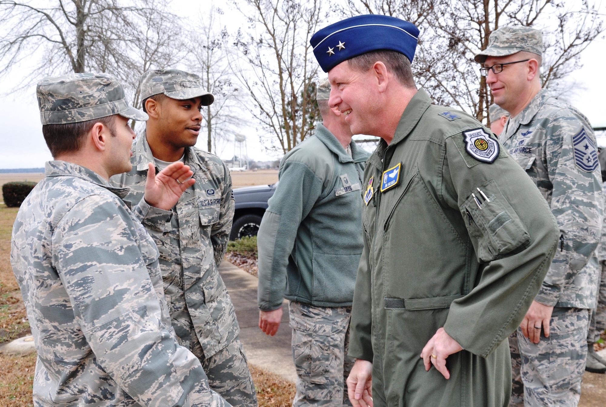 Col. Matthew Baugh, 14th Operations Support Squadron Commander, talks with Maj. Gen. James Hecker, 19th Air Force Commander, Jan. 20 during Hecker’s visit to Columbus Air Force Base, Mississippi, Jan. 20-21. Chief Master Sgt. Robert Boyer, 19th AF Command Chief, accompanied Hecker. (U.S. Air Force photo/Richard Johnson)