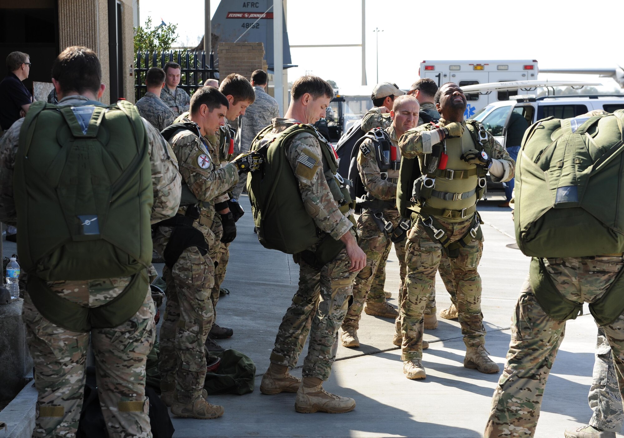 Members of the 334th and 335th Training Squadrons perform a jump master parachute inspection prior to a parachute jump Jan. 20, 2016, Keesler Air Force Base, Miss. Keesler’s battlefield Airmen instructors periodically perform the routine training exercise to maintain their proficiency. (U.S. Air Force photo by Kemberly Groue)