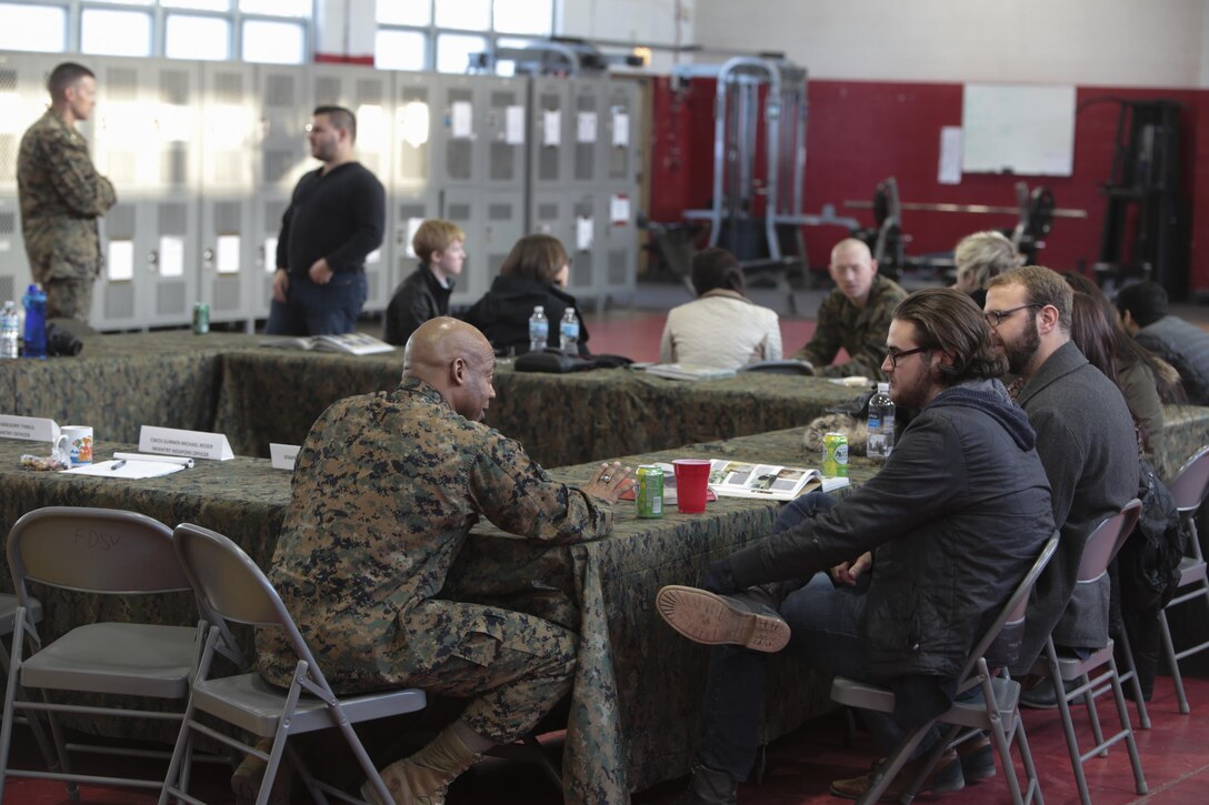 Marines with 2nd Battalion, 24th Marine Regiment, 4th Marine Division, Marine Forces Reserve speak to Columbia College Chicago about the global war on terrorism during an informal discussion at their training center in Chicago, Jan. 20, 2016. During the event, the students who are enrolled in a global war on terror class were encouraged to ask the Marines any questions regarding Operation Enduring Freedom and Operations Iraqi Freedom. While participating, the Marines and students were separated into small groups where they began to talk and share personal stories and experiences about their military career. Many Americans, like the majority of these students, do not have regular interactions with Marines. As the most geographically dispersed command in the Marine Corps, however, Marine Forces Reserve is uniquely positioned to have these kinds of community interactions.