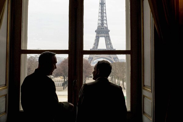 Marine Corps Gen. Joseph F. Dunford Jr., left, chairman of the Joint Chiefs of Staff, and Gen. Pierre de Villiers, chief of France's defense staff, view the Eiffel Tower while meeting at Ecole Militarie, a military school, in Paris, Jan. 22, 2016. DoD photo by D. Myles Cullen