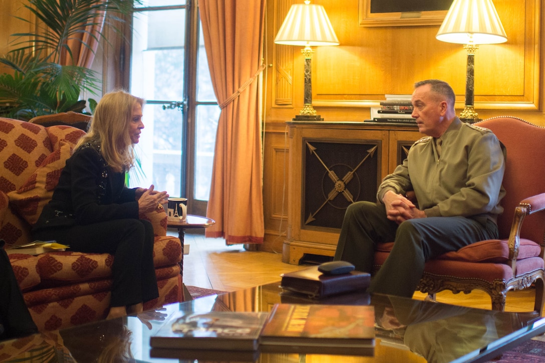 U.S. Marine Corps Gen. Joseph F. Dunford Jr., chairman of the Joint Chiefs of Staff, and Jane D. Hartley, U.S. ambassador to France, talk at the U.S. Embassy in Paris, Jan. 22, 2016. 