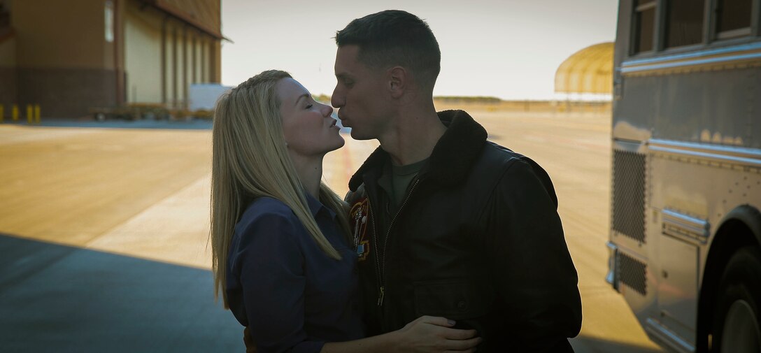 Capt. Benjamin Boera, an AV-8B Harrier pilot with Marine Attack Squadron 311, based out of Marine Corps Air Station Yuma, reunites with his wife at the VMA-311 hanger aboard MCAS Yuma, Ariz. Sunday, Dec. 11 2015. VMA-311 was on a six-month deployment in support of the 15th Marine Expeditionary Unit.
