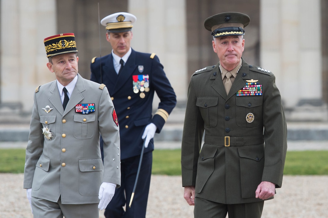 U.S. Marine Corps Gen. Joseph F. Dunford Jr., right, chairman of the Joint Chiefs of Staff, and Gen. Pierre de Villiers, chief of France's defense staff, conduct a military honors ceremony at Ecole Militarie, a military school, in Paris, Jan. 22, 2016. DoD photo by D. Myles Cullen