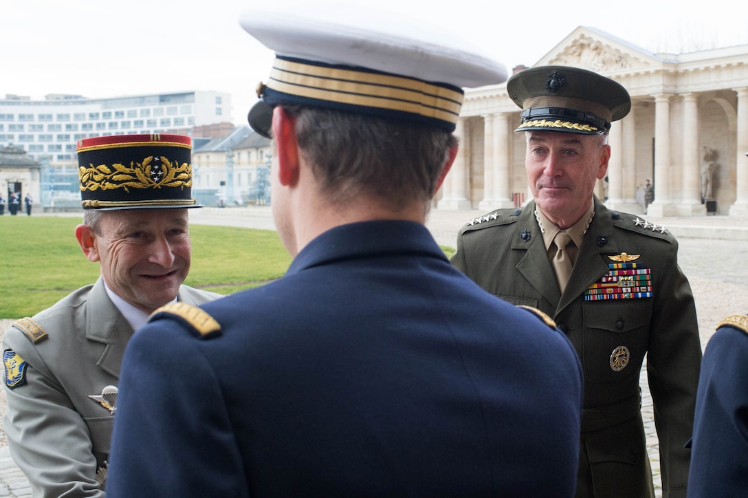 Gen. Pierre de Villiers, chief of France's defense staff, introduces U.S. Marine Corps Gen. Joseph F. Dunford Jr., right, chairman of the Joint Chiefs of Staff, to senior French military leaders at Ecole Militarie in Paris, Jan. 22, 2016. DoD photo by D. Myles Cullen