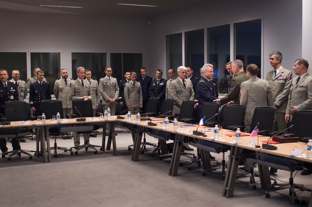 U.S. Marine Corps Gen. Joseph F. Dunford Jr., forth from right, chairman of the Joint Chiefs of Staff, greets senior French military officers before a meeting at the French defense headquarters in Paris, Jan. 22, 2016. DoD photo by D. Myles Cullen