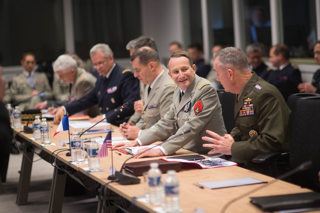 U.S. Marine Corps Gen. Joseph F. Dunford Jr., right, chairman of the Joint Chiefs of Staff, and Gen. Pierre de Villiers, chief of France's defense staff, talk during a meeting at the French defense headquarters in Paris, Jan. 22, 2016. DoD photo by D. Myles Cullen
