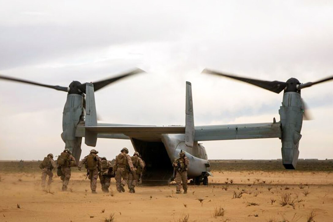Marines return to their aircraft after recovering a simulated casualty as part of a tactical recovery exercise at an undisclosed location in Southwest Asia, Jan. 12, 2016. The Marines are with Charlie Company, 1st Battalion, 7th Marine Regiment. U.S. Marine Corps photo by Cpl. Akeel Austin