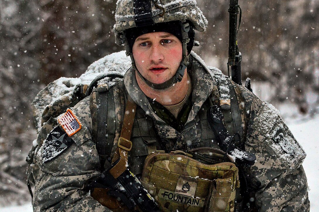 Army Staff Sgt. Ryan Fountain maneuvers through snow during a live-fire exercise on Joint Base Elmendorf-Richardson, Alaska, Jan. 12, 2016. Fountain is a mortarman assigned to Company C, 1st Battalion, 501st Infantry Regiment. U.S. Army photo by John Pennell