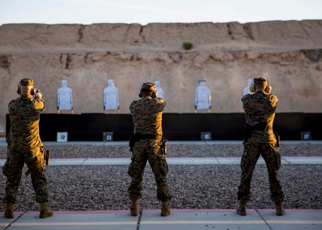 Marines stationed out of Marine Corps Air Station Yuma, Ariz., engage during firearms training and qualification at the station pistol range, Wednesday, Jan. 20, 2016. (U.S. Marine Corps photo by Cpl. Reba James)