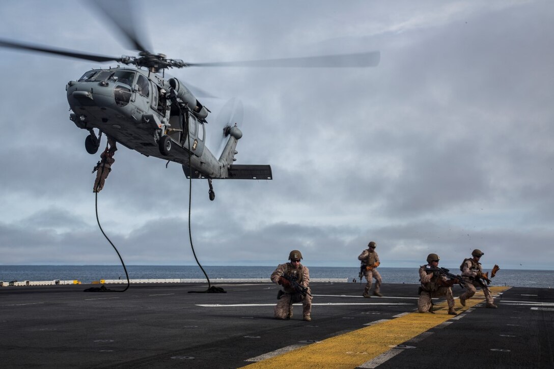 U.S. Marines with Fox Company, 2nd Battalion, 1st Marine Regiment and the Maritime Raid Force with the 13th Marine Expeditionary Unit, fast rope from a CH-60 Seahawk with Helicopter Sea Combat Squadron 23 aboard the USS Boxer off the coast of southern California during their Sustainment Exercise Jan. 17, 2016. SUSTEX is designed to reinforce the Boxer Amphibious Ready Group/MEU's execution of mission essential tasks in preparation for their upcoming deployment. (U.S. Marine Corps photo by Sgt. Tyler C. Gregory/released)