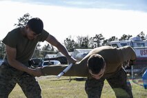 A Marine with Combat Logistics Battalion 22 conducts joint manipulation techniques known as mechanical advantage control holds to gain compliance of an aggressor Camp Lejeune N.C., Jan 14. The non-lethal weapons training course is a two-week course that challenges each Marine to perform under a high intensity situation. The course teaches Marines everything from joint manipulation to riot control. (U.S. Marine Corps photo by Lance Cpl. Luke Hoogendam/Released)