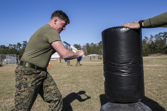 Lance Cpl. Hunter Rooks, a Marine with Combat Logistics Battalion 22, swings at a stationary target after being sprayed in the eyes with oleoresin capsicum, more commonly known as OC spray, at Camp Lejeune N.C., Jan 14. “I feel this was an effective means of instruction because if you or any of your Marines accidentally come in contact with the spray you’re going to know what to expect,” said Jolly. (U.S. Marine Corps photo by Lance Cpl. Luke Hoogendam/Released)