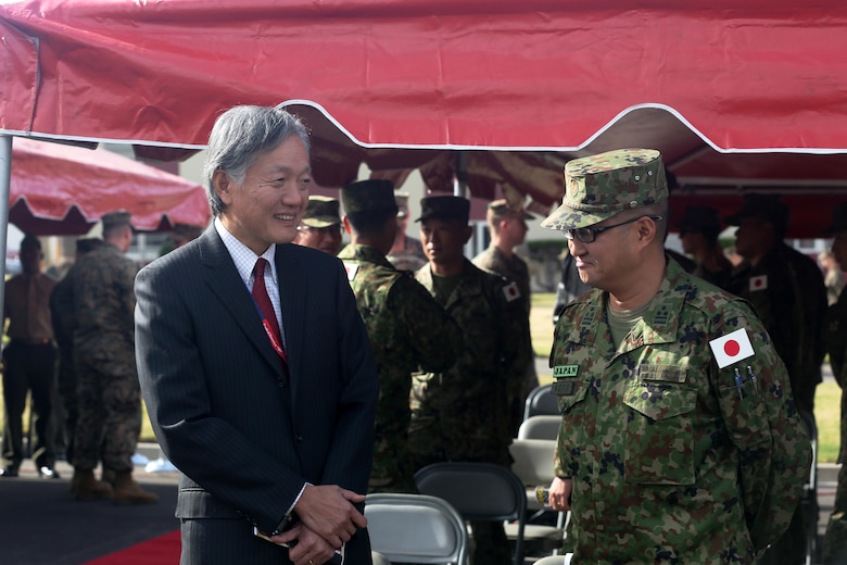 Harry H. Horinouchi (left), the Consul-General of Japan, Los Angeles, speaks with Japan Ground Self Defense Force Col. Yoshiyuki Goto, Western Army Infantry Regimental Commander, following the opening ceremony of Exercise Iron Fist 2016 at Marine Corps Base Camp Pendleton, Calif., Jan. 22, 2016. Exercise Iron Fist is an annual, U.S. Pacific Command, Commander Marine Forces Pacific directed, I Marine Expeditionary Force executed, bilateral amphibious training exercise, held in Southern California. (U.S. Marine Corps photo by Cpl. Garrett White/ Released)