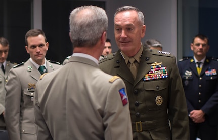 U.S. Marine Corps Gen. Joseph F. Dunford Jr., right, chairman of the Joint Chiefs of Staff, greets a senior French military officer before a meeting at the French defense headquarters in Paris, Jan. 22, 2016. DoD photo by D. Myles Cullen