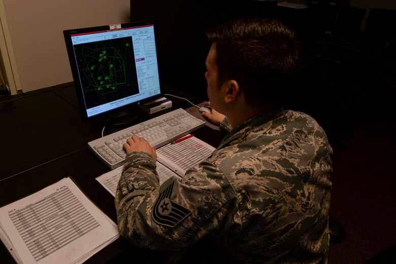 U.S. Air Force Tech. Sgt. Joshua Toellner, 23d Operation Support Squadron air traffic control craftsman, controls a simulator, Jan. 15, 2016, at Moody Air Force Base, Ga. The trainer controls the simulator so ATC trainees get the experience of controlling air traffic without a real consequence of errors. (U.S. Air Force photo by Airman 1st Class Janiqua P. Robinson/Released)