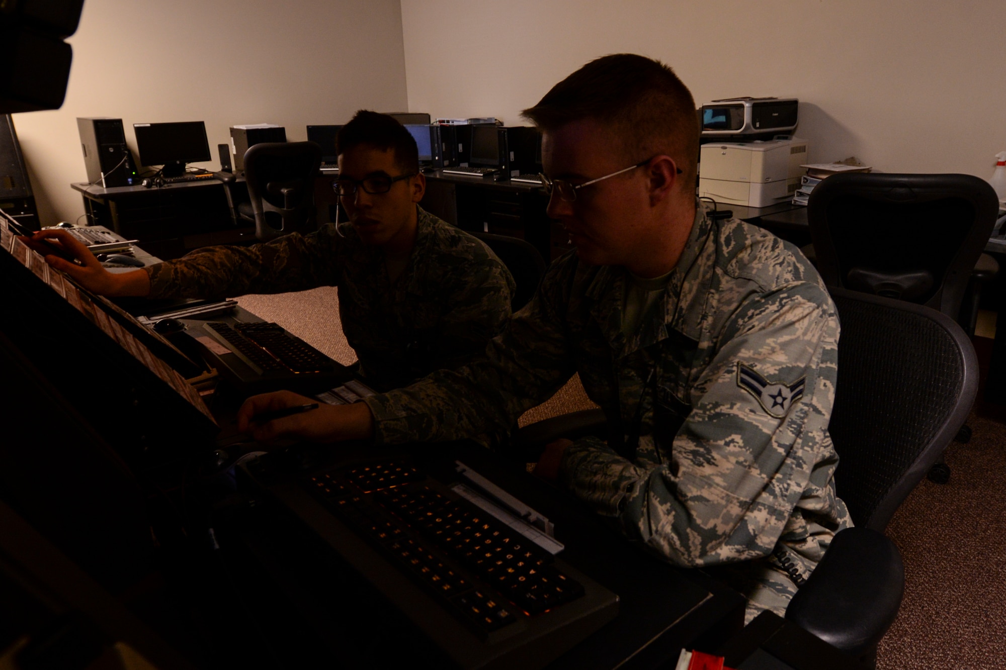 Airmen 1st Class Avery Lardner (right), and Ruben Puebla, 23d Operation Support Squadron air traffic control apprentices, train on a simulator, Jan. 15, 2016, at Moody Air Force Base, Ga.  The simulator gives trainers the opportunity to test how well ATC trainees control multiple aircraft.  (U.S. Air Force photo by Airman 1st Class Janiqua P. Robinson/Released)