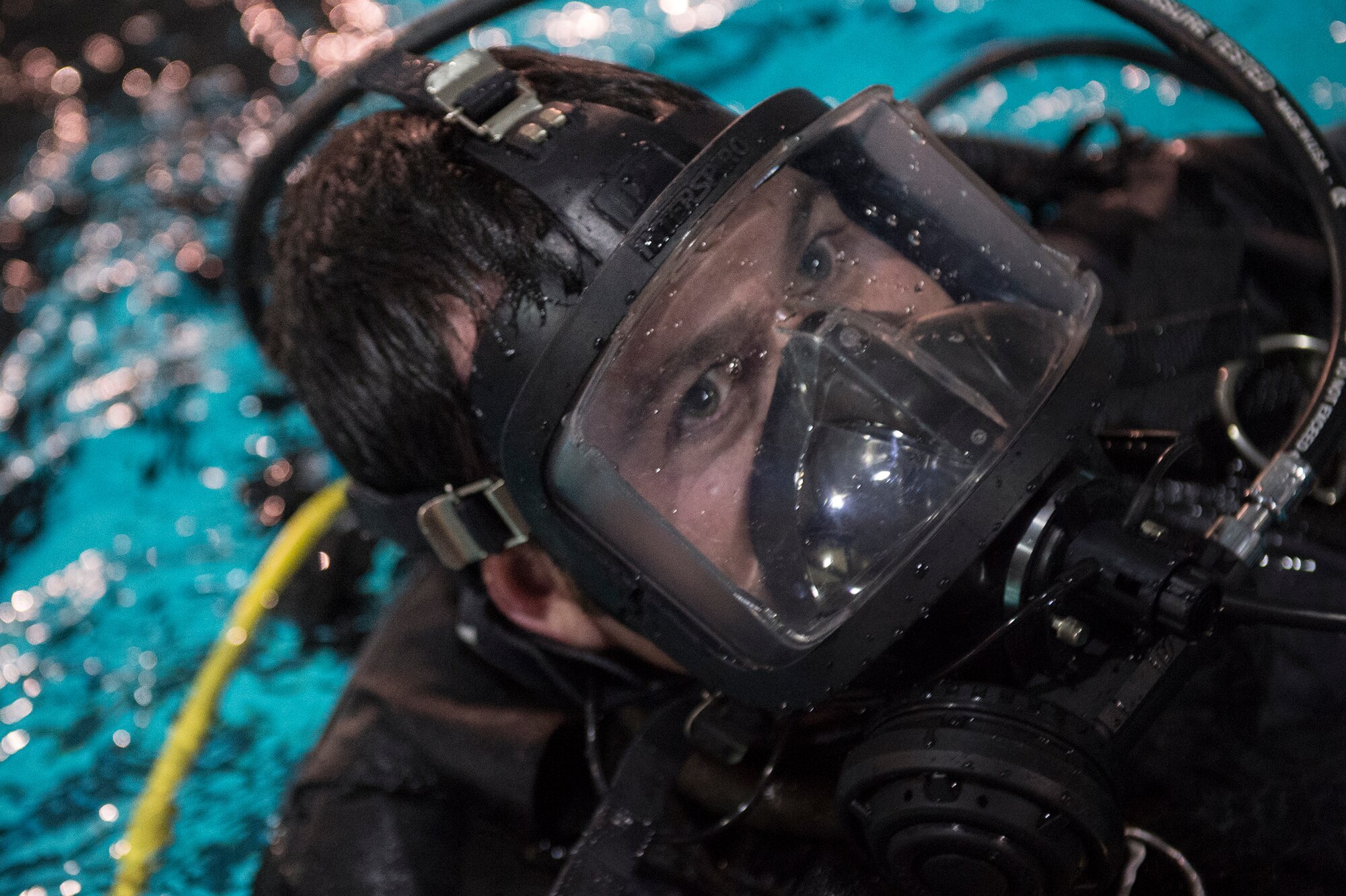 U.S. Air Force Tech. Sgt. George Reed, 38th Rescue Squadron pararescueman, comes up for air during water training , Jan. 20, 2016, at Moody Air Force Base, Ga. Pararescuemen conduct water training regularly to ensure they are prepared to recover isolated personnel from the water even under cold or contaminated conditions. (U.S. Air Force photo by Senior Airman Ceaira Tinsley/Released)