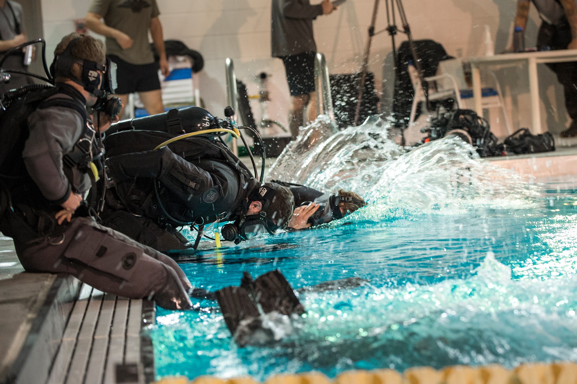 Pararescuemen from the 38th Rescue Squadron dive into the pool, Jan. 20, 2016, at Moody Air Force Base, Ga. As a part of the 347th Rescue Group, pararescuemen recover personnel anywhere in the world utilizing their unique land, air and sea capabilities. (U.S. Air Force photo by Senior Airman Ceaira Tinsley/Released)