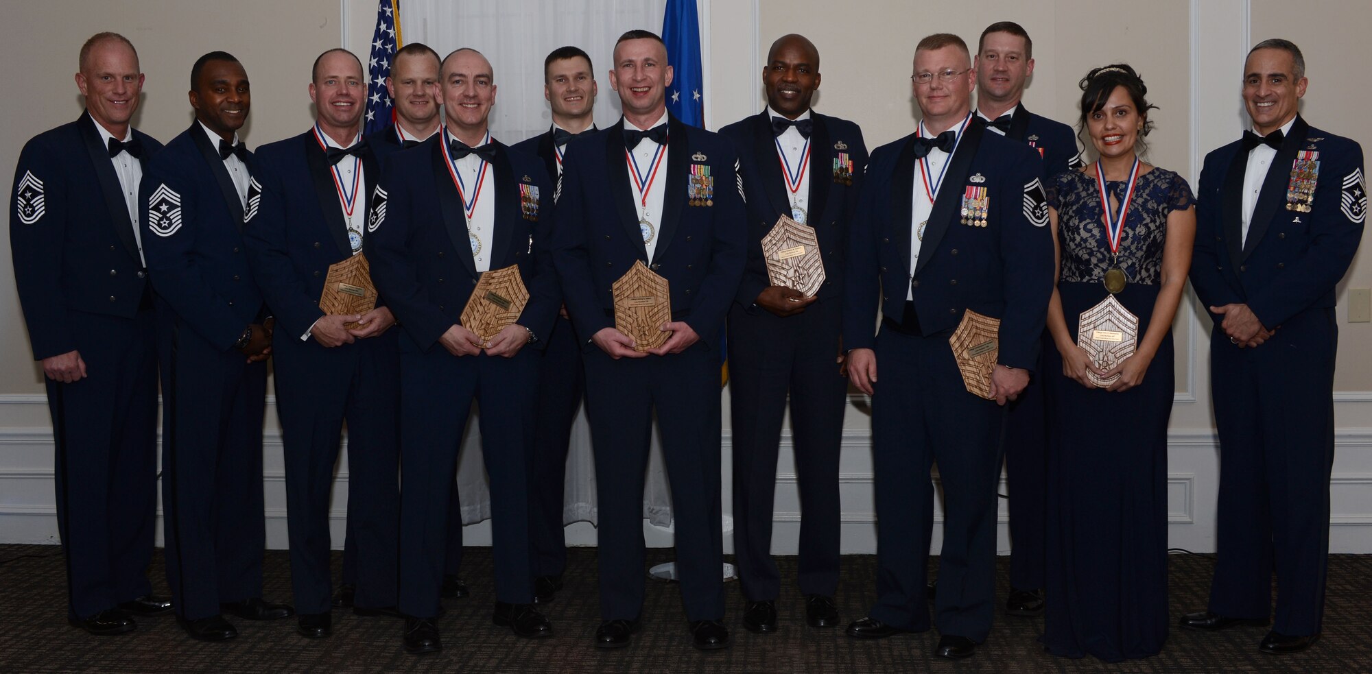 Command chiefs from Team Shaw stand with senior NCOs who made the rank of chief master sergeant following a Chief’s Induction Ceremony at Shaw Air Force Base, S.C., Jan. 21, 2016. Nine Team Shaw senior master sergeants were selected to be promoted to the rank of chief master sergeant, an accomplishment that is earned by only one percent of American Airmen. (U.S. Air Force photo by Senior Airman Zade C. Vadnais)