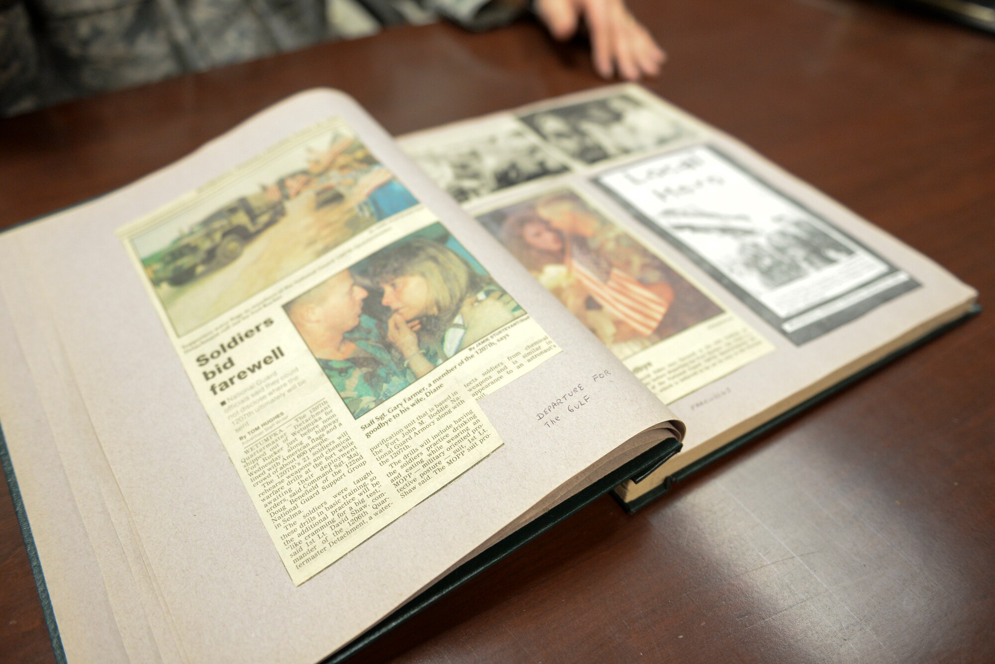 A scrapbook of Desert Storm articles and photos lays open on a table at Mountain Home Air Force Base, Idaho, Jan. 13, 2016. Maj. Alexander Palomaria, 366th Fighter Wing deputy chaplain, used scrapbooking as a way of coping with the war. (U.S. Air Force photo by Airman 1st Class Jessica H. Evans/RELEASED)