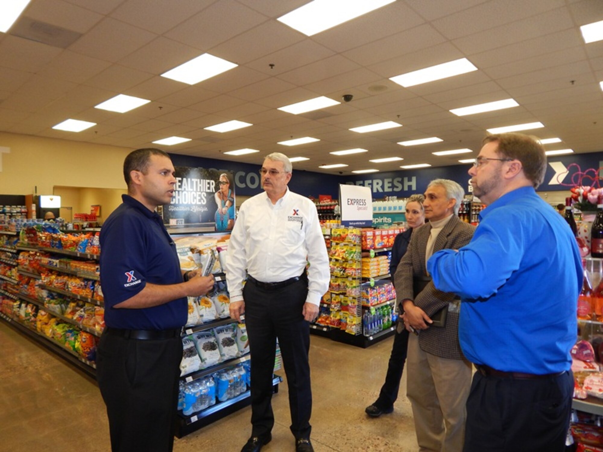 Army & Air Force Exchange Service Deputy Director Mike Immler (second from right) tours the Express at Davis-Monthan AFB. Manager Antonio Lopez-Santiago (right), Assistant Manager Mari McPherson and Exchange Western Region Senior Vice President Ken Brewington accompanied Immler on his visit to the Express. The Express, which was renovated in October, is stocked with salads, fresh fruit and snacks so Airmen can make healthy choices on the go. (Courtesy Photo)