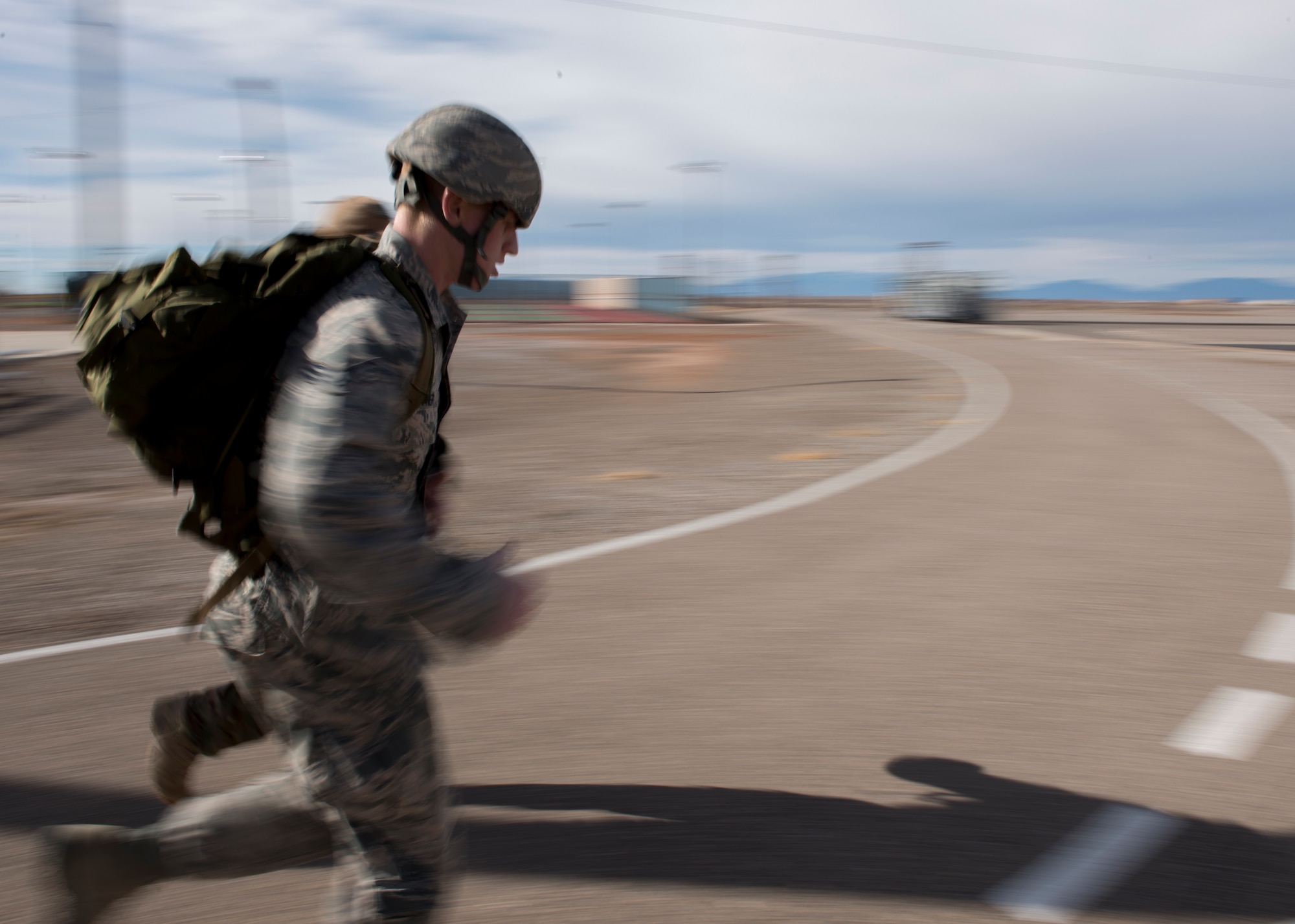 Senior Airman Zakariah Heffner, 49th Civil Engineer Squadron surveyor, sprints the final leg of a 4-mile ruck during a Battlefield Airmen Day at Holloman Air Force Base on Jan. 15. Air Force Special Forces members from Fort Bliss and Holloman facilitated the event to educate Airmen on the physical and mental standards set by Air Force Special Forces. “This is a great opportunity for Airmen who are trying to cross-train, said Chief Master Sgt. Scott Loescher, Holloman’s Command Chief. “It’s going to show what level of commitment they have.” (U.S. Air Force photo by Airman 1st Class Randahl J. Jenson)