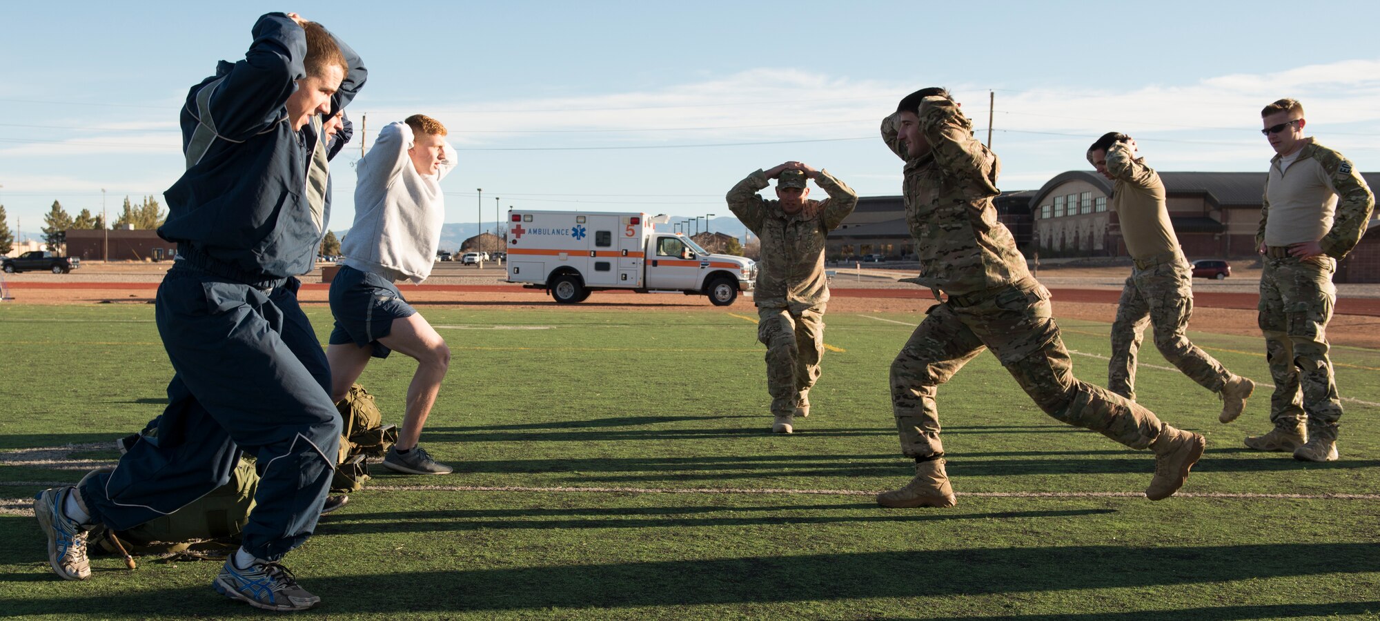 Members from various Air Force Special Forces career fields lead Airmen in a lunging exercise during a Battlefield Airmen Day at Holloman Air Force Base on Jan. 15. Air Force Special Forces members from Fort Bliss and Holloman facilitated the event to educate Airmen on the physical and mental standards set by Air Force Special Forces. “This is to show them where they stand and what training they need to progress,” said Senior Airman Neiko Guillory, a Tactical Air Control Party member from Fort Bliss, Texas. (U.S. Air Force photo by Airman 1st Class Randahl J. Jenson)
