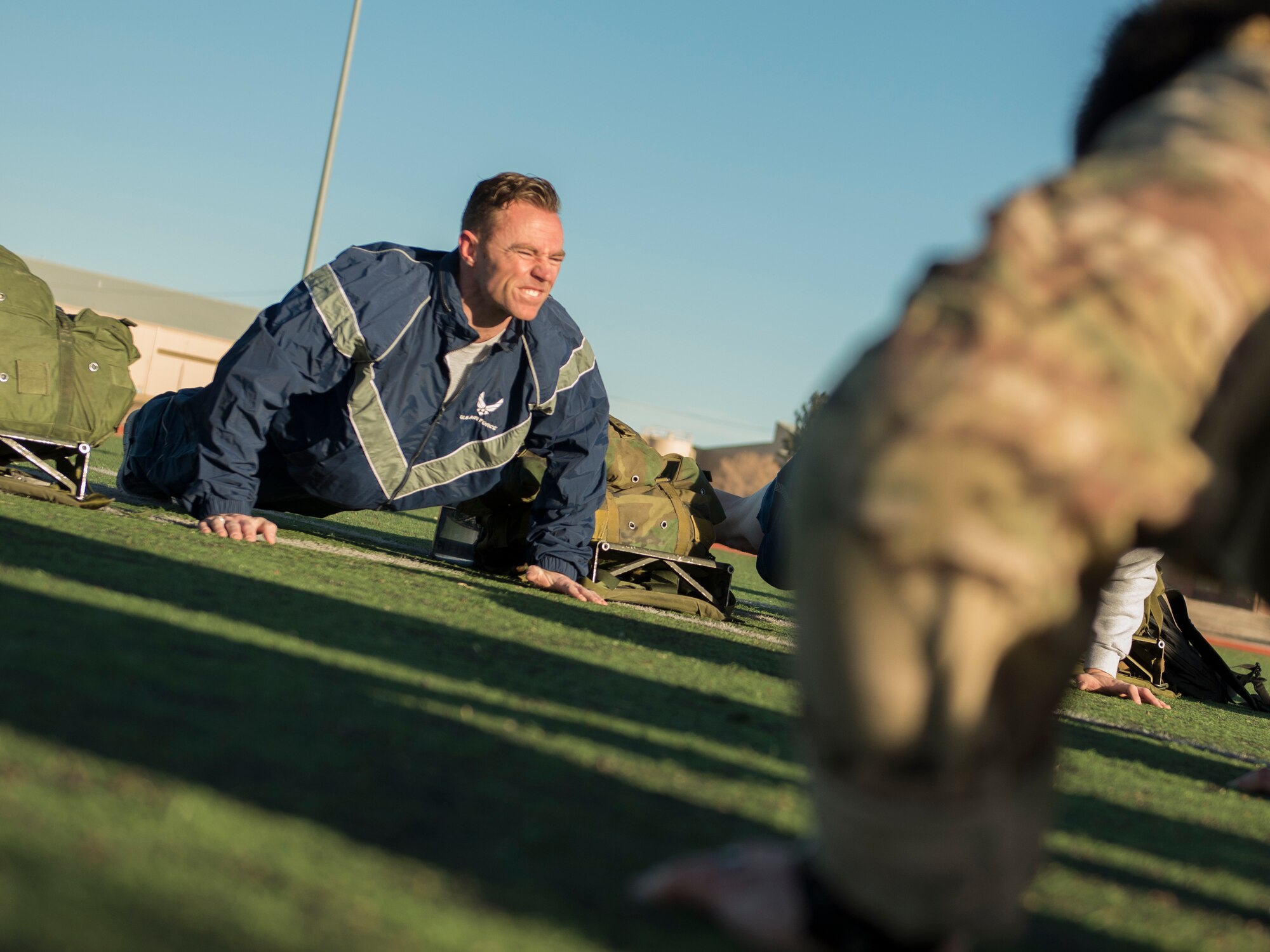 Staff Sgt. Destin Yates, a 49th Operation Support Squadron weather forecaster, performs push ups during a Battlefield Airmen Day at Holloman Air Force Base on Jan. 15. Air Force Special Forces members from Fort Bliss and Holloman hosted the event to help Airmen gauge their physical abilities compared to the standards required of an Air Force Special Forces career field. “It was a challenge,” said Yates. “But, it was easy to be motivated because these guys came from all over to help us out.” (U.S. Air Force photo by Airman 1st Class Randahl J. Jenson)