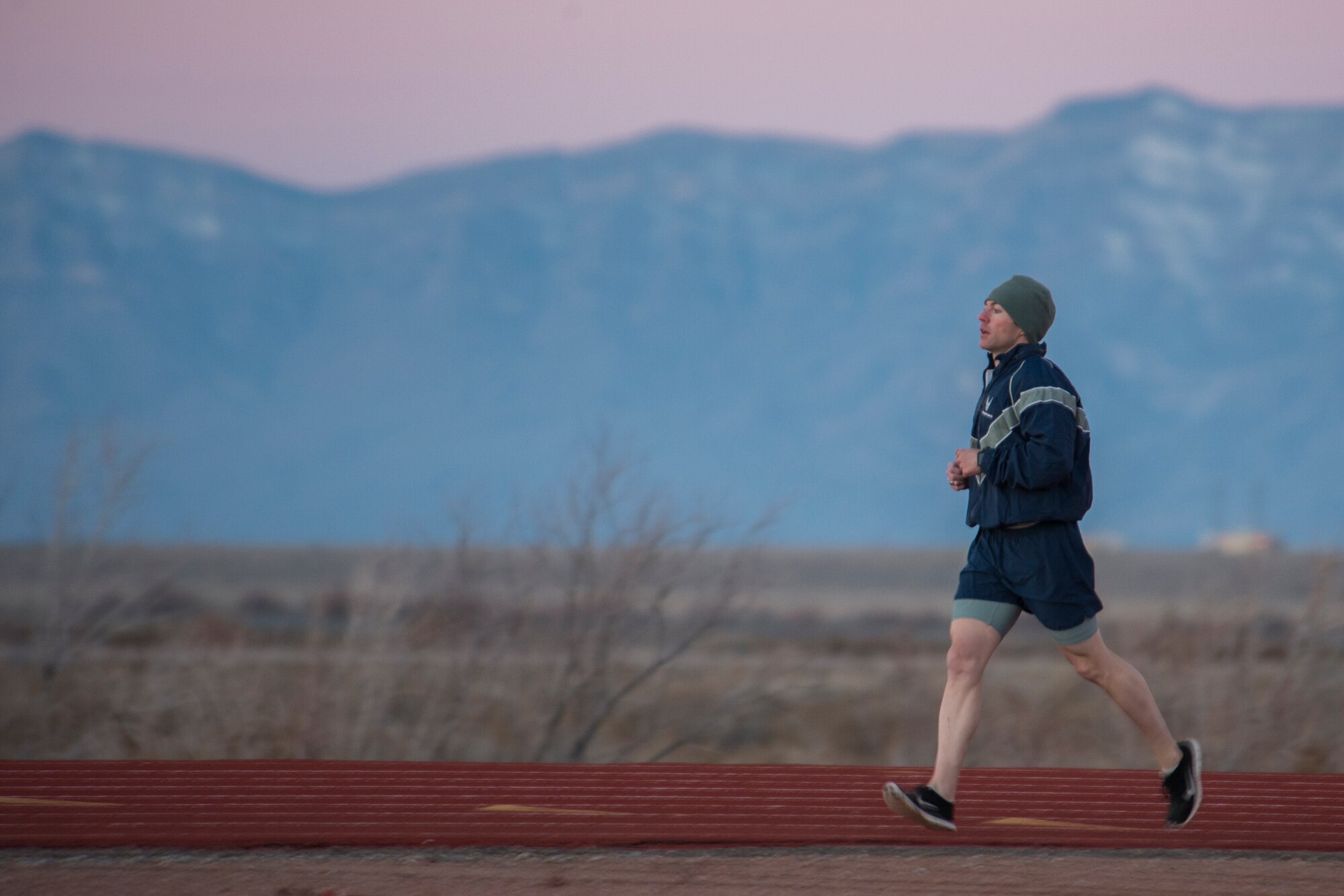 Staff Sgt. Destin Yates, a 49th Operation Support Squadron weather forecaster, rounds the last curve of his 1.5 mile Physical Ability and Stamina Test run during a Battlefield Airmen Day at Holloman Air Force Base on Jan. 15. For Airmen looking to cross-train into the Air Force Special Forces career fields, Battlefield Airmen Days are provided to test their physical and mental readiness. “This is a great opportunity for Airmen who are trying to cross-train,” said Chief Master Sgt. Scott Loescher, Holloman’s Command Chief. “It’s going to show what level of commitment they have.” (U.S. Air Force photo by Airman 1st Class Randahl J. Jenson)