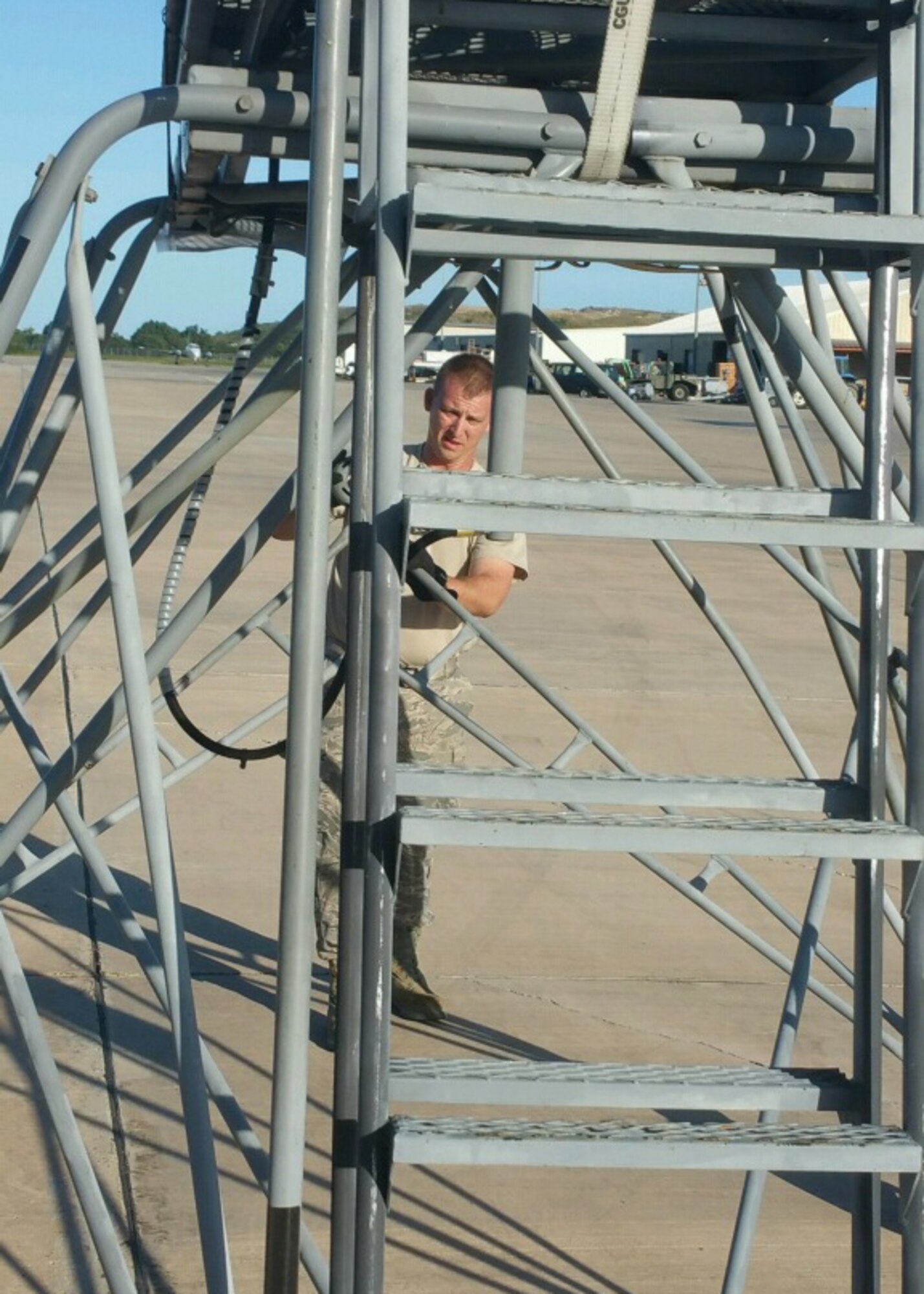 Tech. Sgt. Brandon Chain, an air transportation craftsman with the 41st Aerial Port Squadron at Keesler Air Force Base, Mississippi, moves a stand at the Rohlsen International Airport St. Croix, U.S. Virgin Islands during the 53rd Weather Reconnaissance Squadron “Hurricane Hunters” Roll Up mission Jan. 10-17, 2016. The airport is the forward operating base for the 53rd Weather Reconnaissance Squadron “Hurricane Hunters.” (U.S. Air Force photo/Master Sgt. Brian J. Lamar)