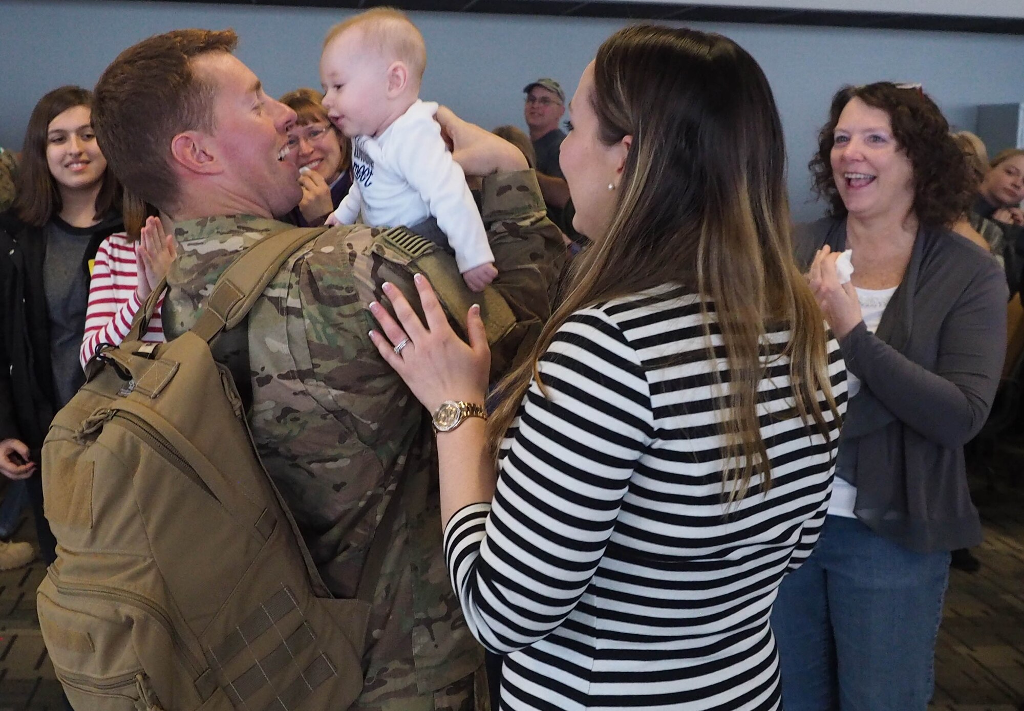 Members of the 934th Civil Engineer Squadron return home Jan. 21 after their deployment to Southwest Asia. (Air Force Photo/Paul Zadach)