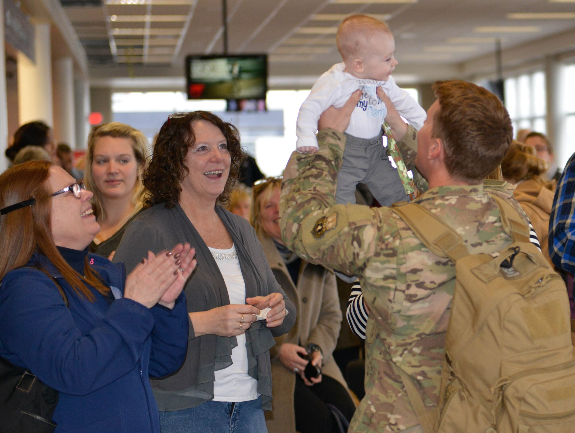 Members of the 934th Civil Engineer Squadron return home Jan. 21 after their deployment to Southwest Asia. (Air Force Photo/Capt. William-Joseph Mojica)
