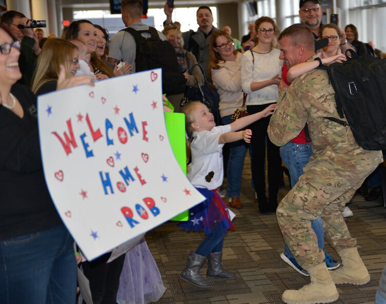 Members of the 934th Civil Engineer Squadron return home Jan. 21 after their deployment to Southwest Asia. (Air Force Photo/Capt. William-Joseph Mojica)