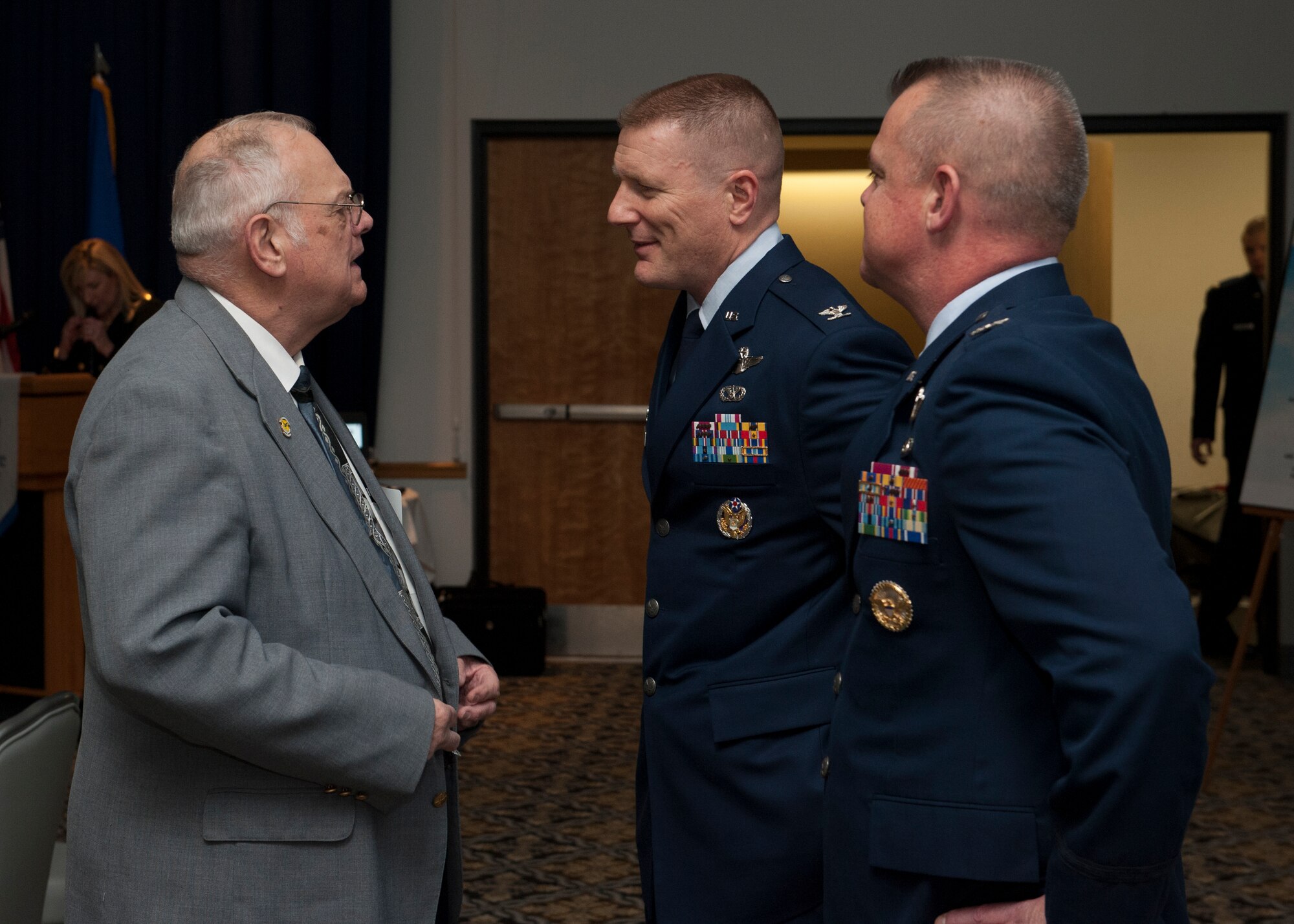 Carleton Carey, former Mayor of Dover, Del., speaks with Col. Michael Grismer, 436th Airlift Wing commander, and Col. D. Scott Durham, 512th AW commander, at the 2016 Military Affaire Social Jan. 21, 2016, at the Landings on Dover Air Force Base, Del. This annual social is key to building a strong relationship between Dover AFB and the local community. (U.S. Air Force photo/Senior Airman Zachary Cacicia) 