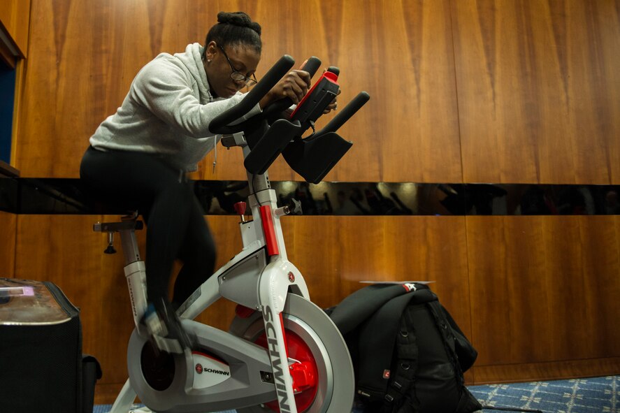 U.S. Air Force Tech. Sgt. Marcie Ireland, 52nd Force Support Squadron operations manager, exercises on a stationary bike during the Health Celebration in the Club Eifel Ballroom on Spangdahlem Air Base, Germany, Jan. 21, 2016. Event organizers selected ‘New Year, New You’ as the theme to promote healthier choices with the start of 2016. (U.S. Air Force photo by Airman 1st Class Luke Kitterman/Released)