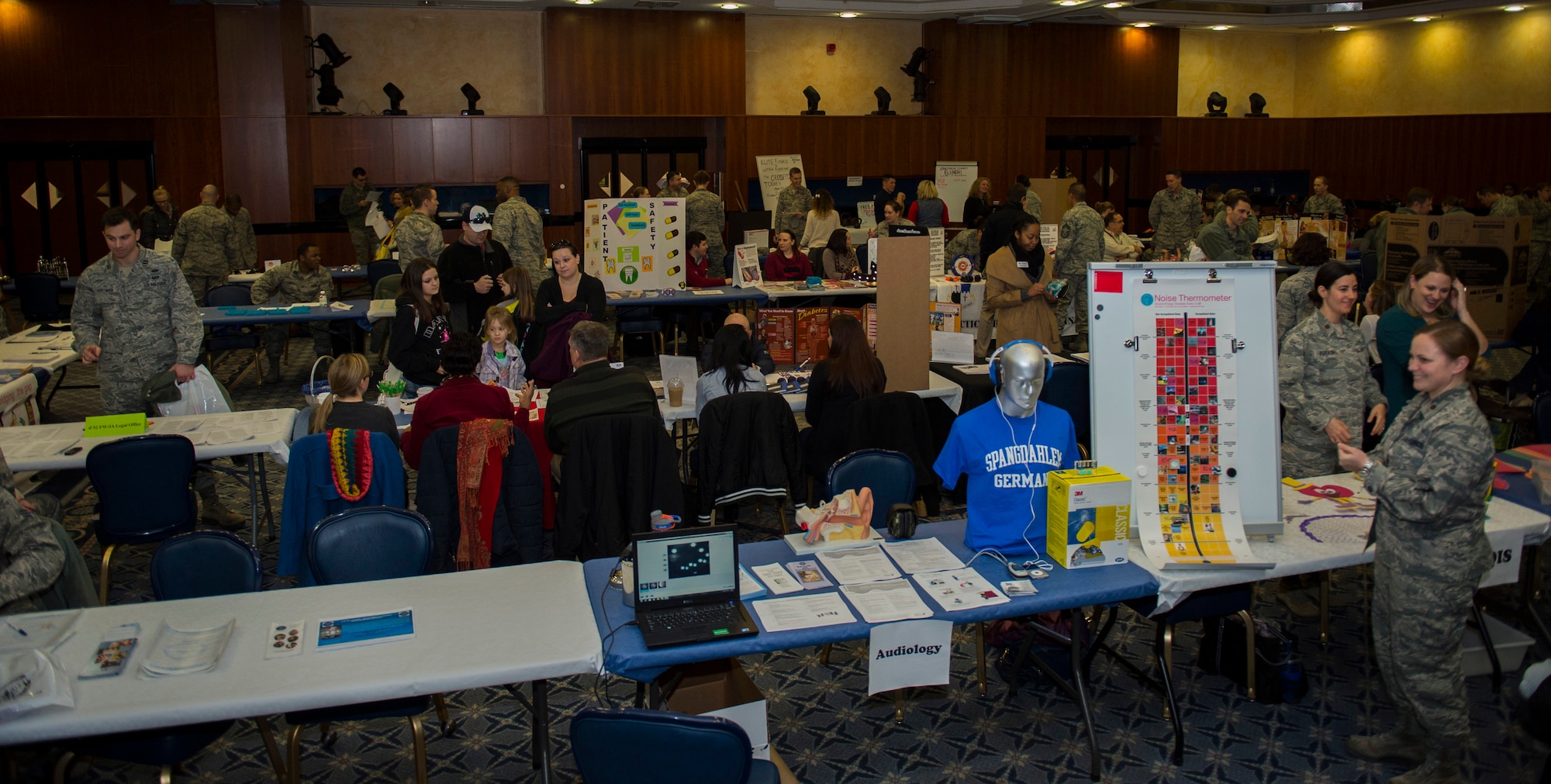 Spangdahlem community members explore the different information tables at the Health Celebration in the Club Eifel Ballroom on Spangdahlem Air Base, Germany, Jan. 21, 2016. Over 40 base agencies provided a wide range of health services and information to more than 300 attendees. (U.S. Air Force photo by Airman 1st Class Luke Kitterman/Released)