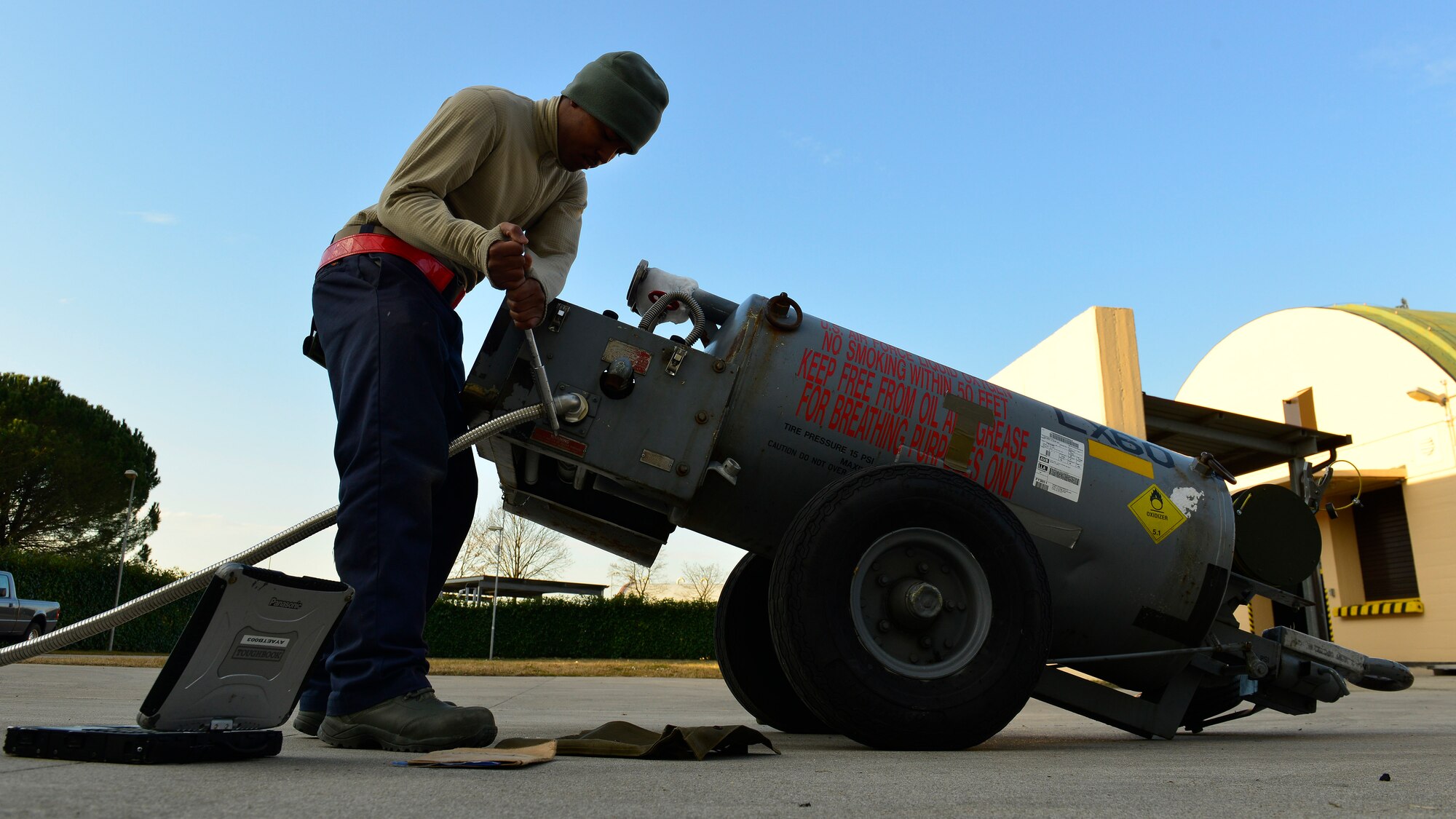 U.S. Air Force Airman 1st Class Isiah Smothers, 31st Maintenance Squadron Electrical and Environmental journeyman, performs maintenance on a liquid oxygen tank, Jan. 20, 2016, at Aviano Air Base, Italy. The E&E section collaborates with the 31st Logistics Readiness Squadron Petroleum, Oils and Lubricants section to ensure each tank is ready for use on the flightline. (U.S. Air Force photo by Airman 1st Class Cary Smith/Released)