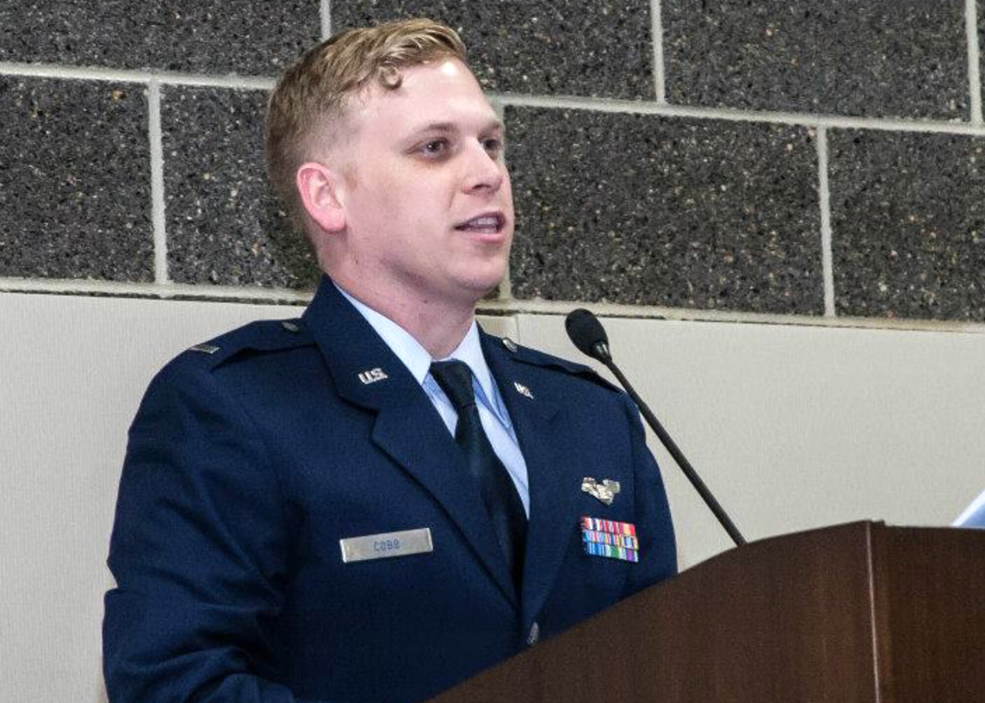 Capt. Ryan Cobb, 384th Air Refueling Squadron pilot, speaks to cadets and senior members of the Emerald City Composite Squadron during an annual awards banquet, Dec. 2015, in Wichita, Kan. Cobb has been mentoring cadets just as he was in his teens and is proud to be able to give back. (Courtesy photo) 
